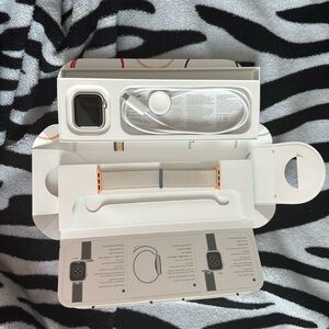 Apple Smartwatch with Silver and Orange Accents